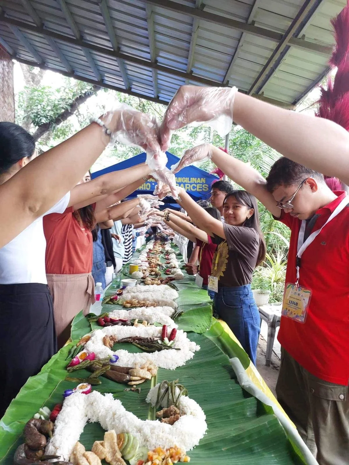 Ako Ang Saklay community members sharing a meal