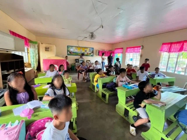 Students learning in an Ako Ang Saklay-supported classroom; faces are blurred for privacy