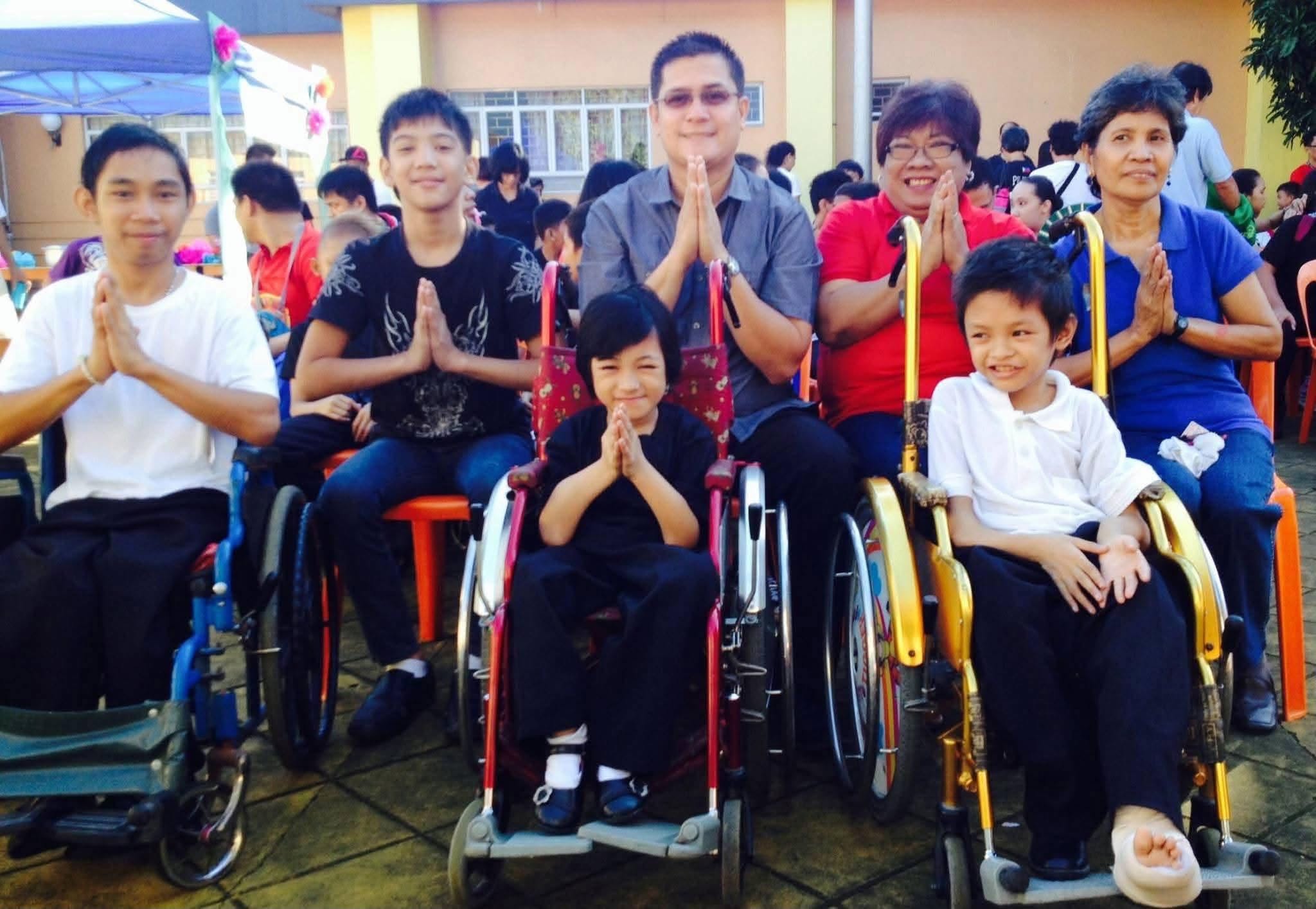 Ako Ang Saklay community members, including persons using wheelchairs, gathered at an activity